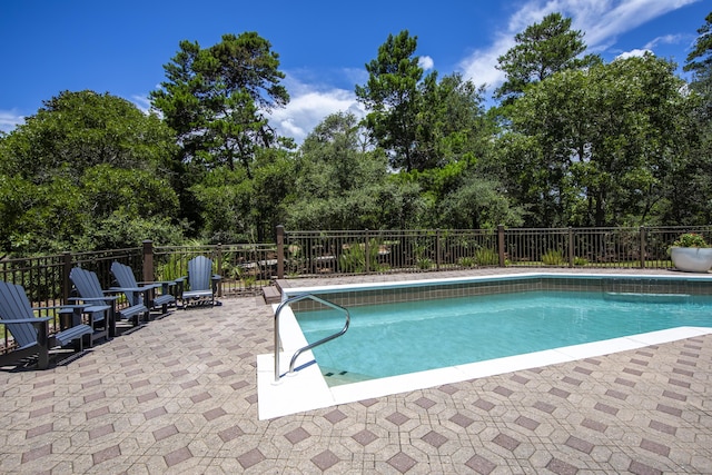 view of pool featuring a patio, fence, and a fenced in pool