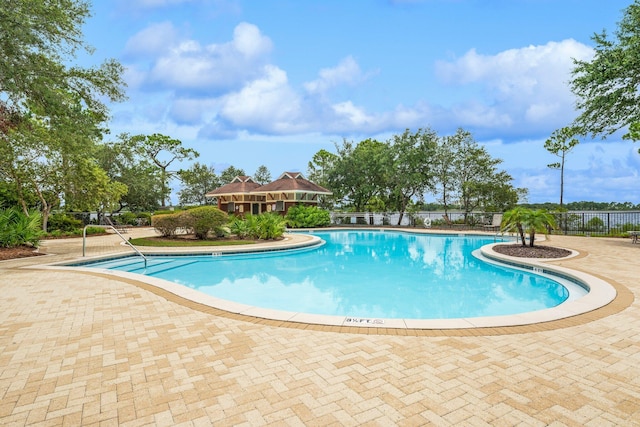 view of swimming pool featuring a patio