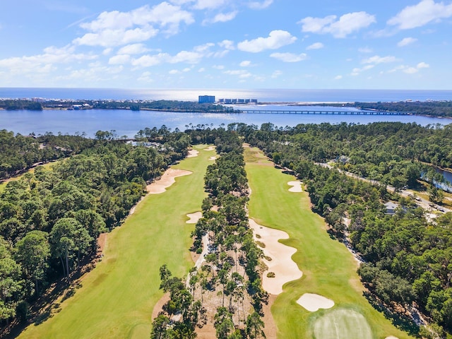 birds eye view of property featuring golf course view and a water view