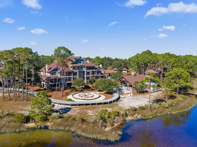 birds eye view of property with a water view