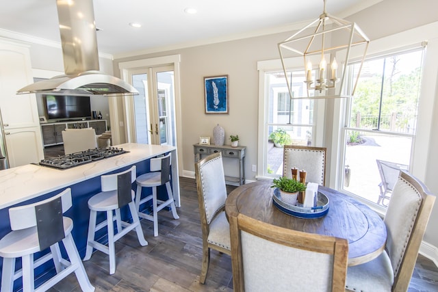 dining space featuring baseboards, dark wood-style floors, ornamental molding, an inviting chandelier, and french doors