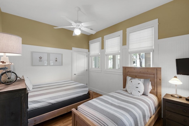 bedroom featuring ceiling fan and hardwood / wood-style floors