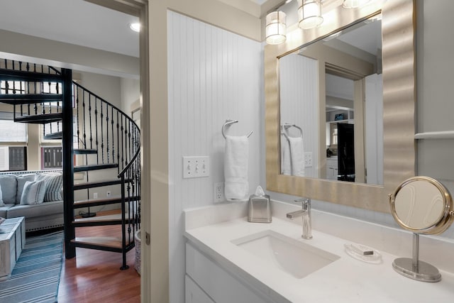 bathroom with vanity and hardwood / wood-style flooring