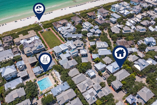 birds eye view of property featuring a water view and a view of the beach