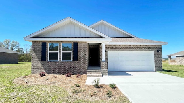 view of front of house with a front lawn and a garage