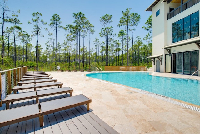 view of pool featuring a patio area