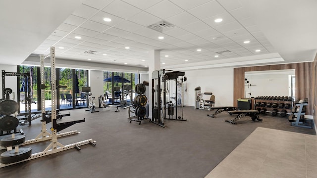 exercise room with a tray ceiling