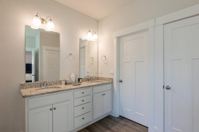 bathroom featuring vanity and hardwood / wood-style floors