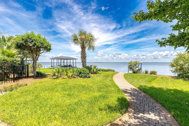 view of yard featuring a water view and a gazebo