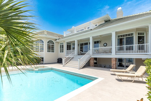 view of swimming pool with a patio area