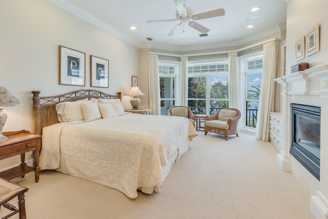 carpeted bedroom with crown molding, access to exterior, and ceiling fan