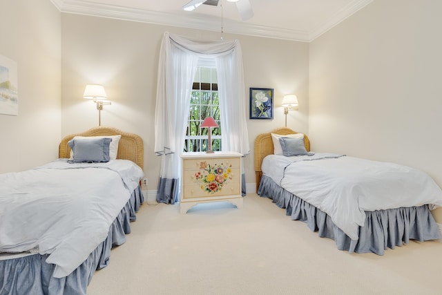 carpeted bedroom with crown molding and ceiling fan