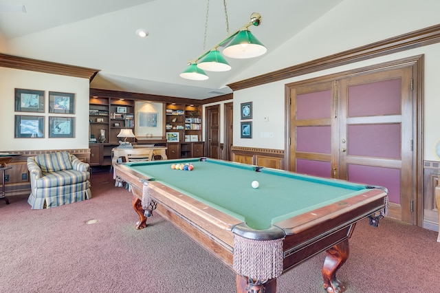 game room featuring built in features, vaulted ceiling, ornamental molding, and dark colored carpet