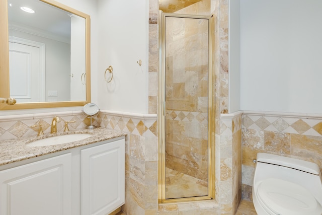 bathroom featuring walk in shower, toilet, crown molding, tile walls, and vanity