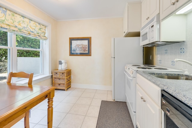 kitchen featuring tasteful backsplash, white cabinetry, crown molding, and white appliances