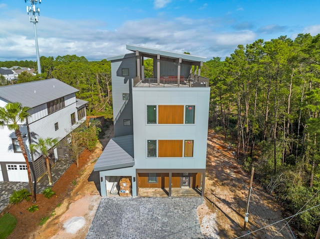 rear view of house featuring a balcony