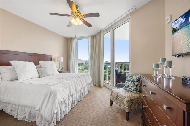 bedroom featuring ceiling fan, floor to ceiling windows, access to exterior, and multiple windows