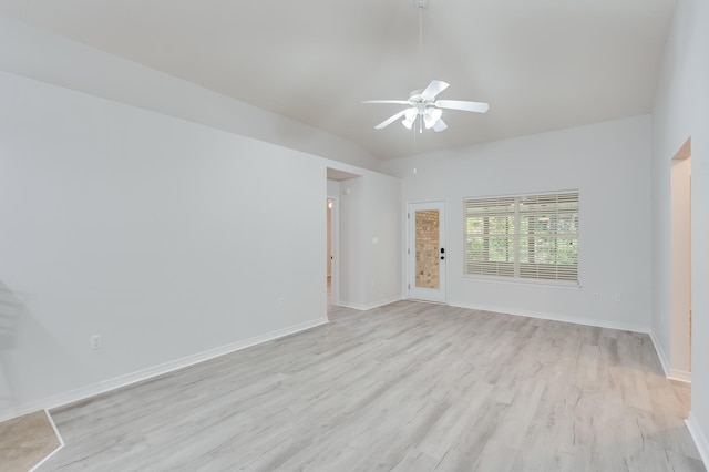 unfurnished room with ceiling fan, lofted ceiling, and light wood-type flooring