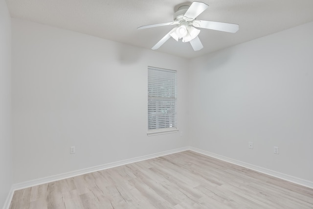 unfurnished room with light hardwood / wood-style flooring and ceiling fan