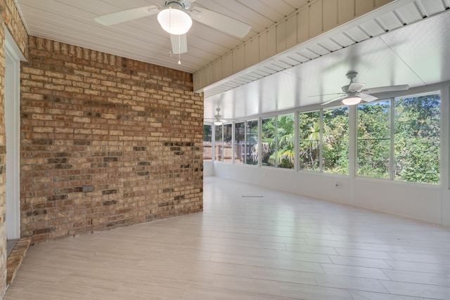 unfurnished sunroom with wooden ceiling