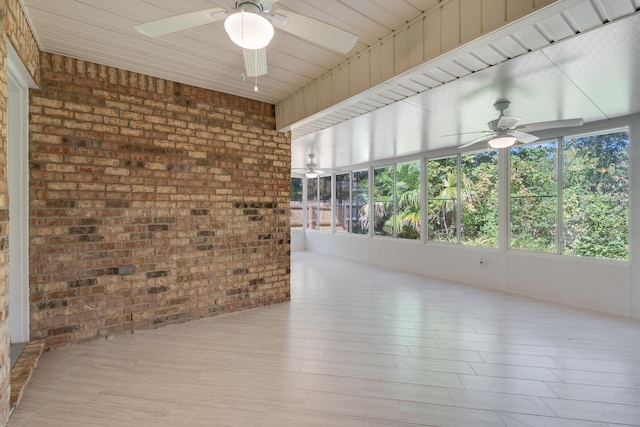 unfurnished sunroom with wooden ceiling