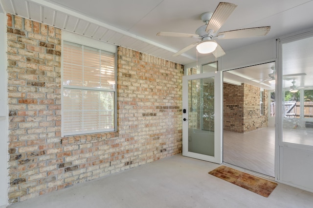 property entrance with ceiling fan