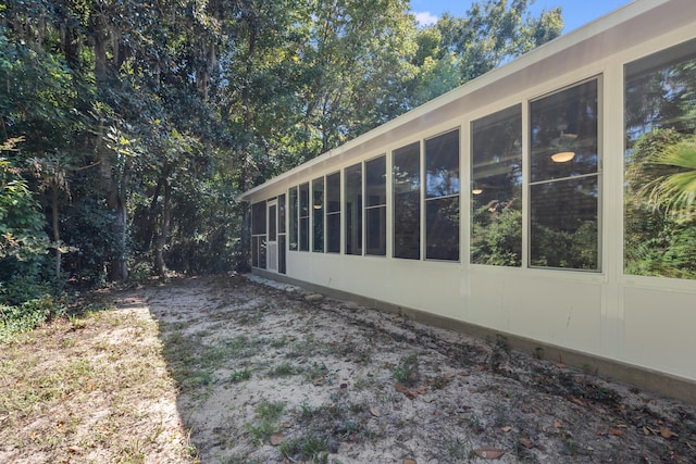 view of home's exterior featuring a sunroom