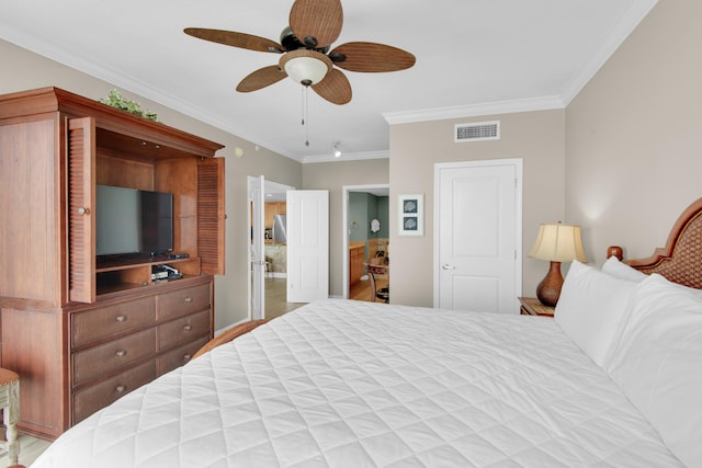 bedroom with ceiling fan and crown molding