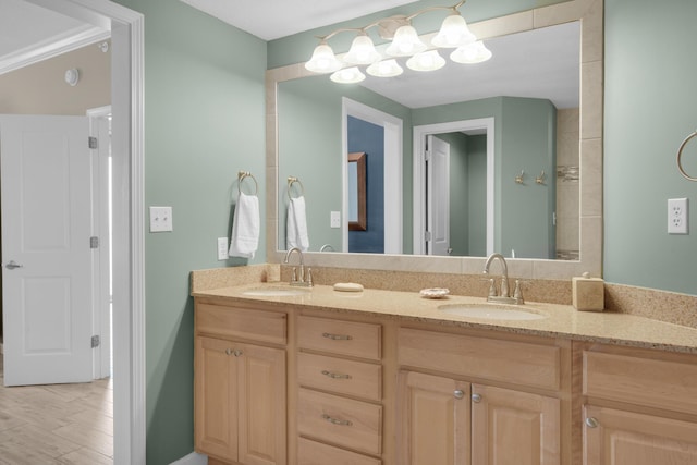 bathroom with vanity and ornamental molding