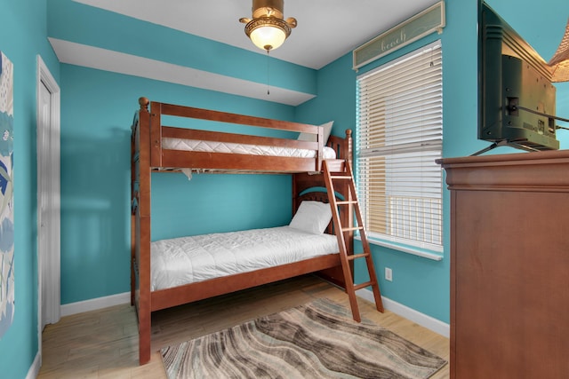 bedroom featuring ceiling fan and hardwood / wood-style floors