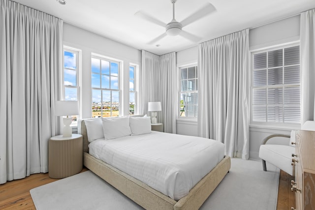 bedroom featuring ceiling fan and hardwood / wood-style flooring