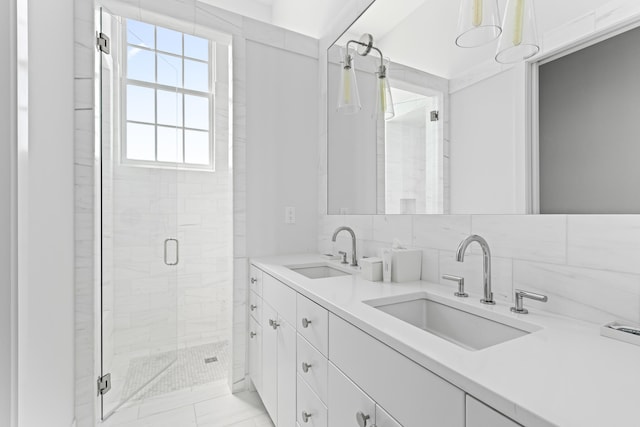 bathroom with tile patterned flooring, vanity, decorative backsplash, tile walls, and a shower with shower door