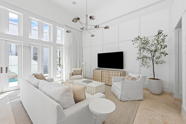 26 N Sea Garden St Unit Z17, Inlet Beach, FL 32461 - living area featuring a chandelier and a towering ceiling