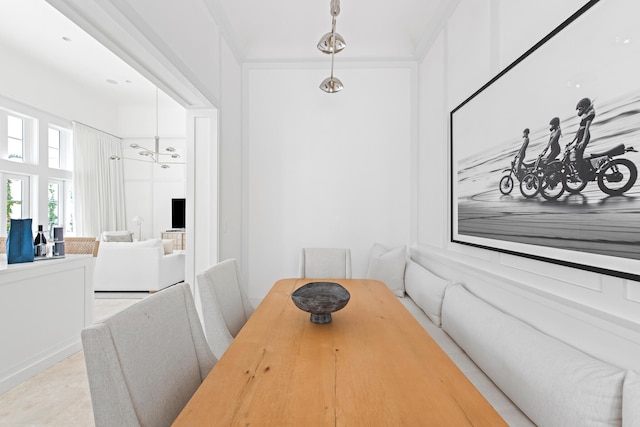 dining area featuring a notable chandelier and light tile patterned floors