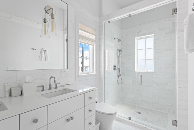 26 N Sea Garden St Unit Z17, Inlet Beach, FL 32461 - bathroom featuring toilet, vanity, a shower stall, and decorative backsplash