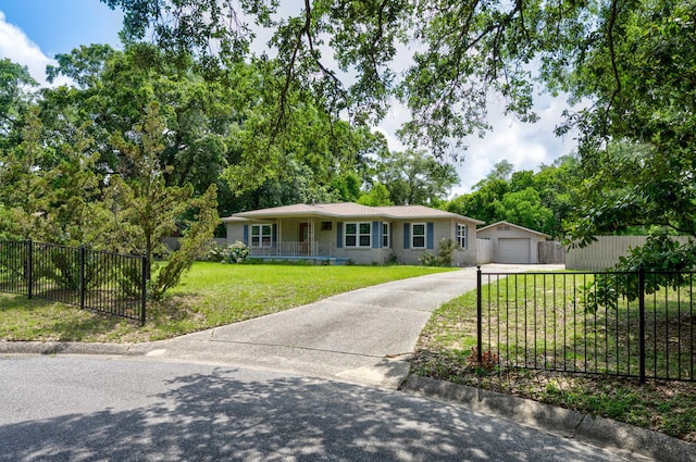 ranch-style home with a garage, an outdoor structure, and a front lawn