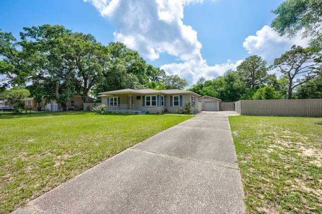 ranch-style home featuring a front yard and covered porch