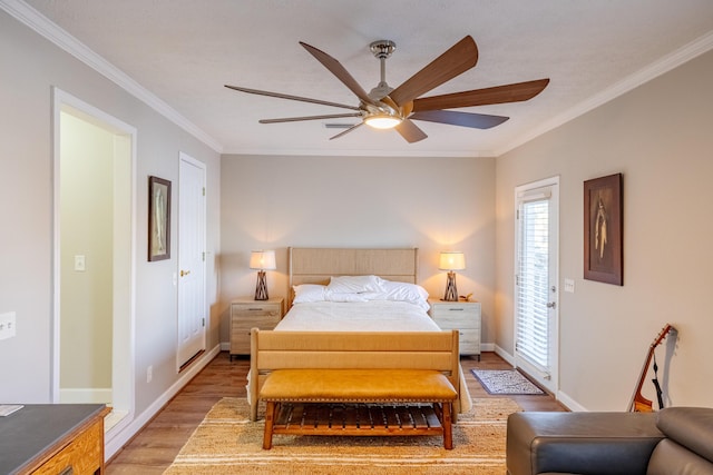 bedroom featuring light wood-type flooring, baseboards, ceiling fan, and crown molding