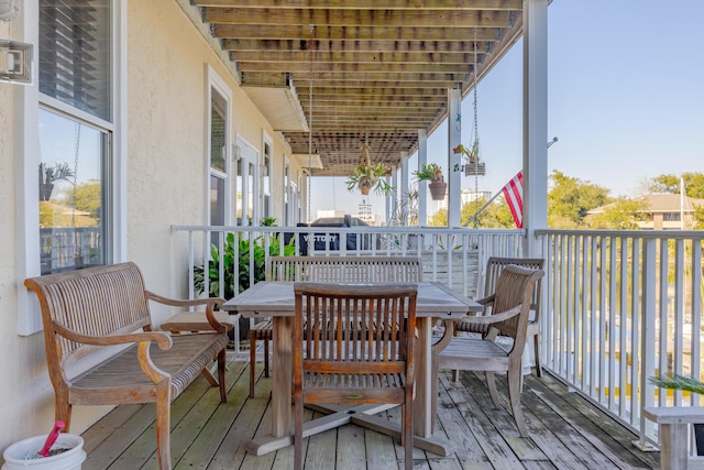 wooden deck with outdoor dining area