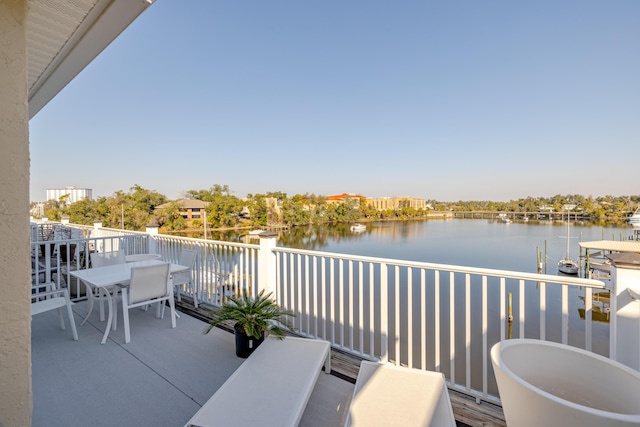 balcony featuring a water view