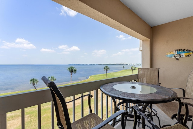 balcony featuring a water view