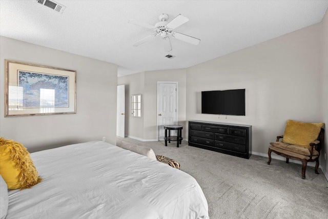 bedroom with baseboards, visible vents, and light colored carpet