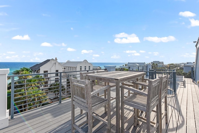 wooden terrace featuring a water view