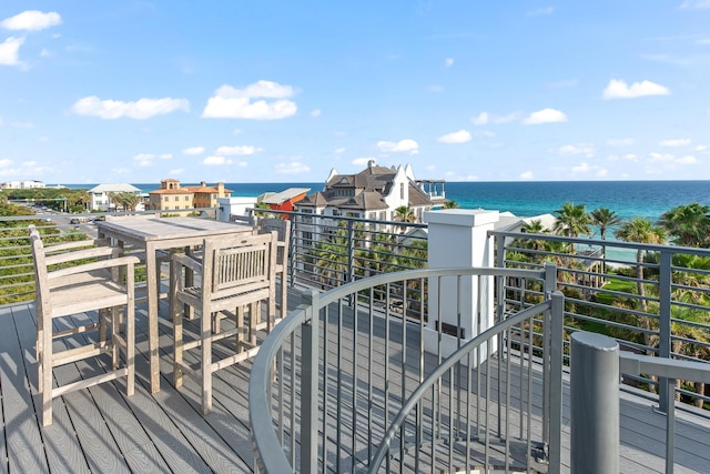 wooden deck featuring a water view