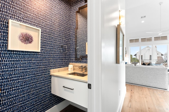 bathroom with hardwood / wood-style flooring and vanity