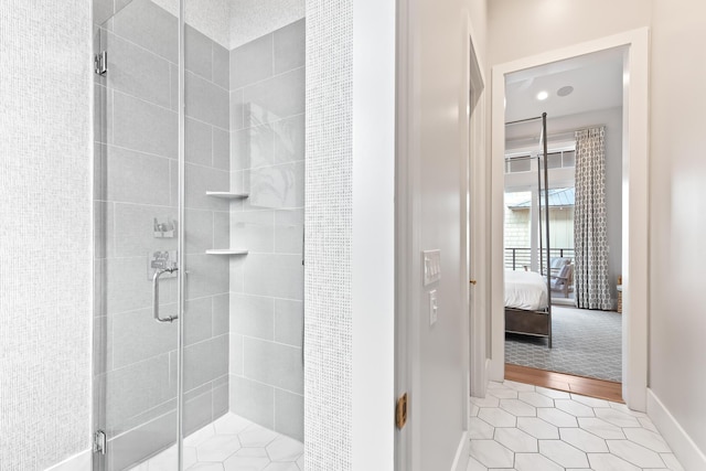 bathroom featuring a shower with shower door and tile patterned floors