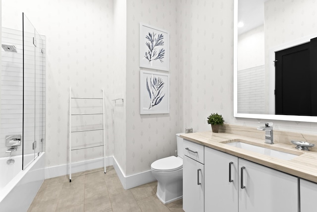 full bathroom with tiled shower / bath combo, vanity, toilet, and tile patterned flooring