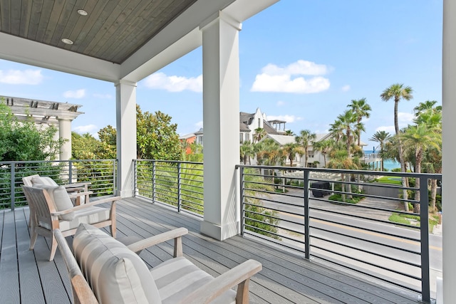 wooden deck featuring a water view