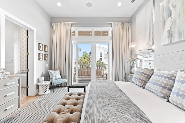 bedroom featuring access to outside and light wood-type flooring