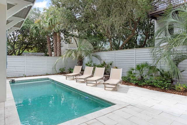 view of swimming pool featuring a patio